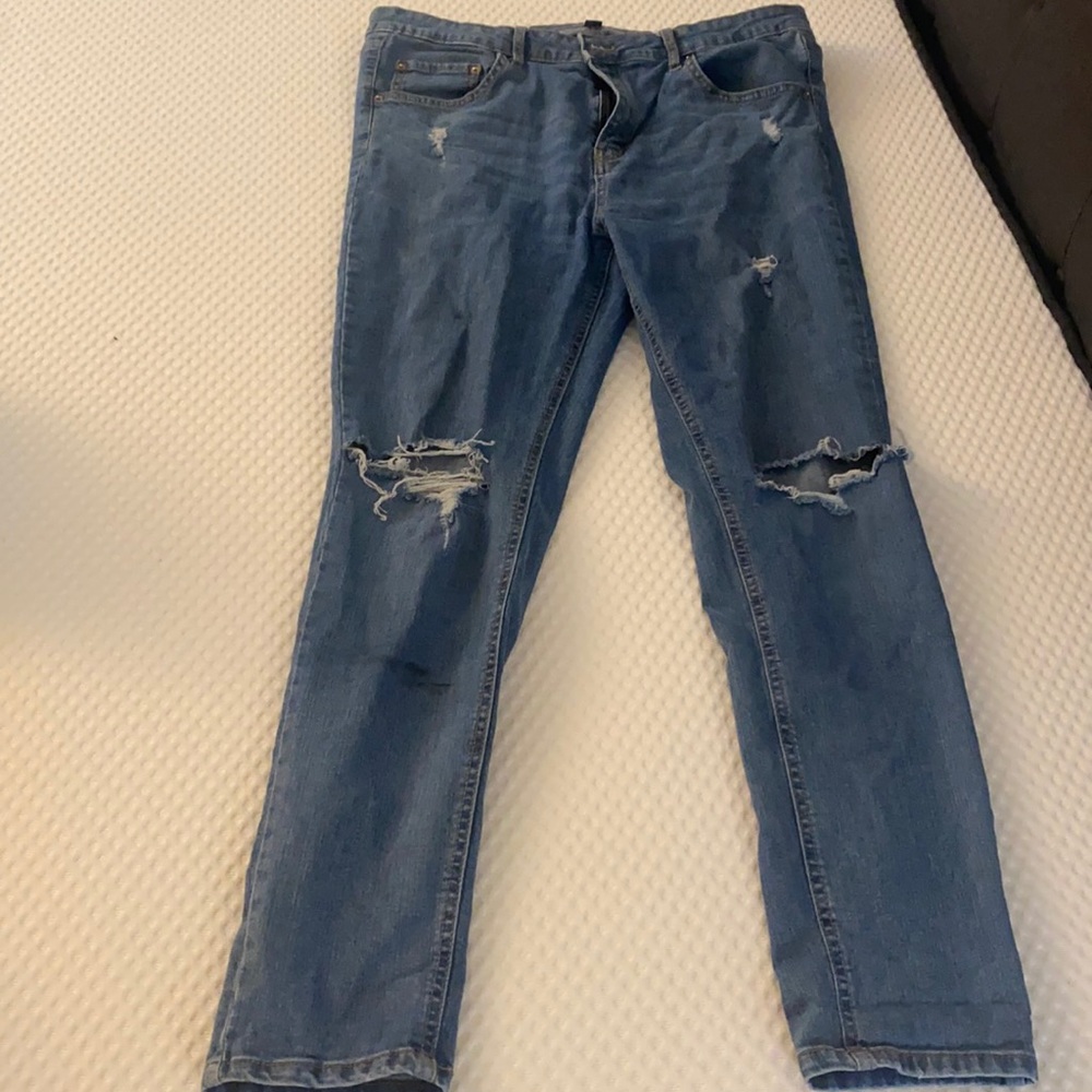 High rise blue jeans ripped